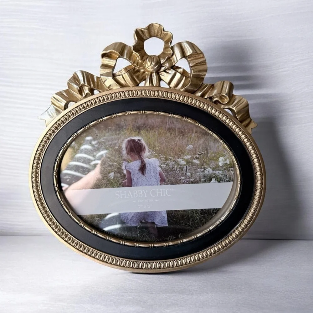 Ornate Oval Gold Photo Frame with Black Trim bow on top 7”x5”